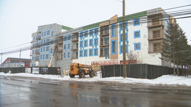 A building is under construction during the winter.