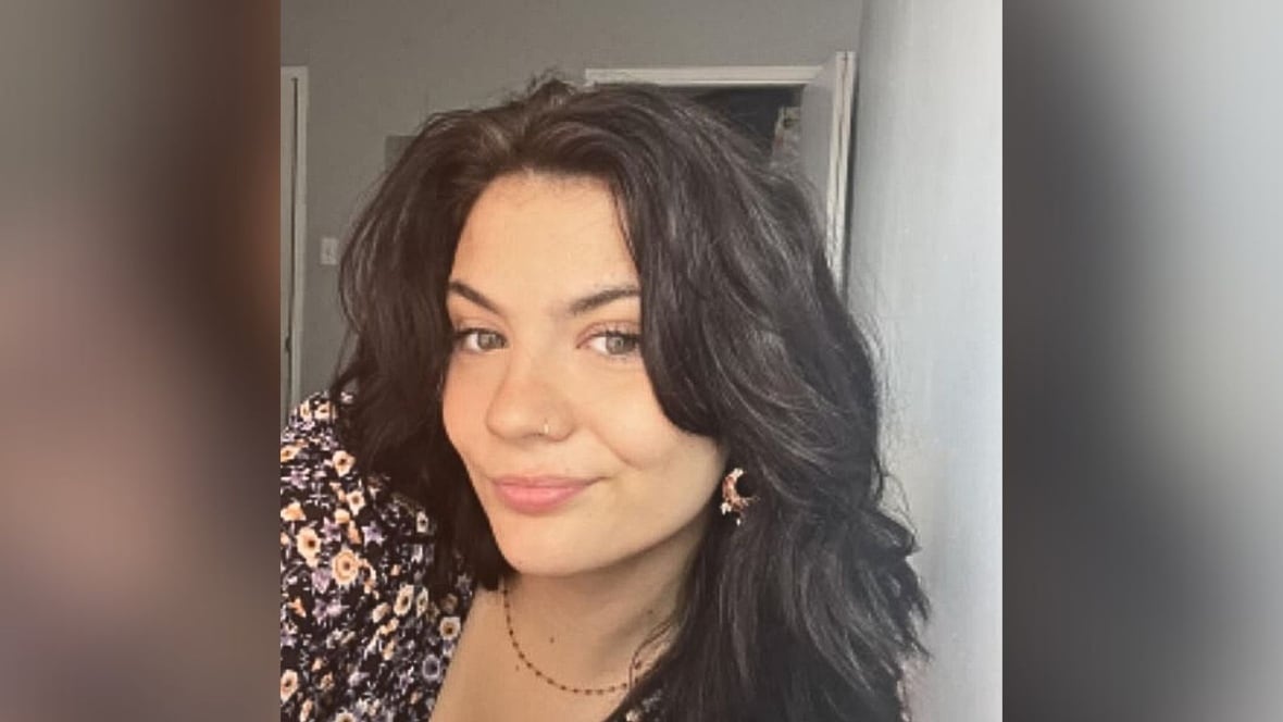 A young woman poses for the camera.
