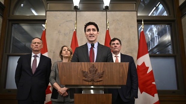 Trudeau hits back at the U.S. with big tariffs after Trump launches a trade war; Prime Minister Justin Trudeau addresses media following the imposition of a raft of tariffs by U\.S\. President Donald Trump against Canada, Mexico and China, in Ottawa, Saturday, Feb\. 1, 2025\. Minister of Public Safety David McGuinty, left to right, Global Affairs Minister Melanie Joly and Minister of Governmental Affairs Dominic LeBlanc look on\.