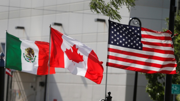 Canada is in a trade war with the U.S. and things could get rough. Here's what to expect; Flags of the U\.S\., Canada and Mexico fly next to each other in Detroit, Michigan, U\.S\. August 29, 2018\.  REUTERS/Rebecca Cook