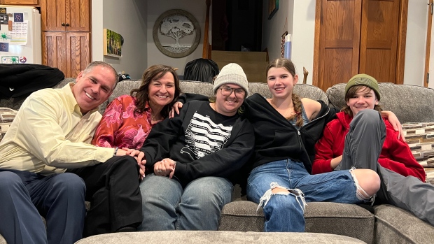Trans families consider leaving U.S. after Trump's re-election; Kelli says her family has already looked at moving to Canada from the U\.S\. if health care for her son Ollie, centre, is threatened\.