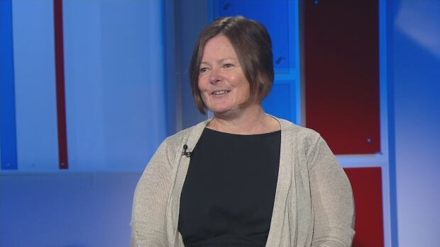 A woman is interviewed on television