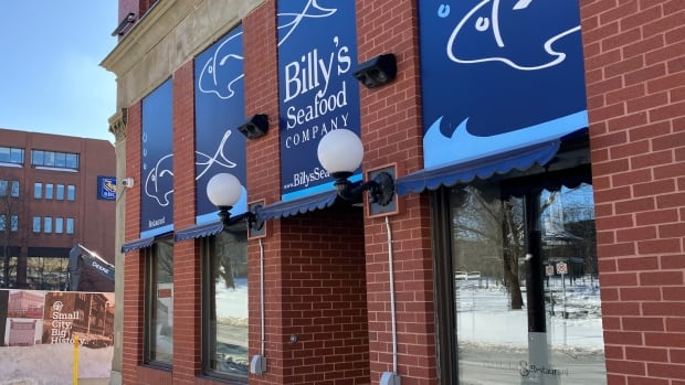 Billy's Seafood, a mainstay of the Saint John area, closed for good on Feb. 4. A storefront in a brick building showing a sign that says Billy's Seafood Company.