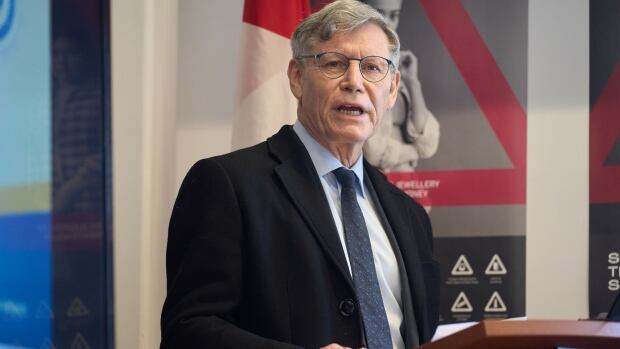 Minister responsible for Prairies Economic Development Canada Terry Duguid speaks to law enforcement officers at the border crossing between Canada and the U.S.A., in Emerson, Man., Tuesday, Feb. 4, 2025 at the Emerson Port of Entry. T A man speaks at a podium.