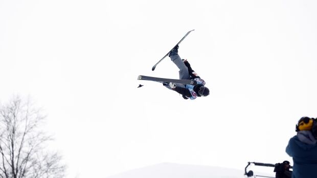 BAKURIANI, GEORGIA - MARCH 4: Rachael Karker of Team Canada wins the bronze medal during the FIS Freestyle World Ski Championships Men's and Women's Free Ski Halfpipe on March 4, 2023 in Bakuriani, Georgia. (Photo by Alexis Boichard/Agence Zoom/Getty Images) A skier does tricks in a halfpipe.