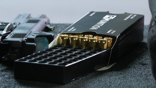 A box of ammunition sits open at the Calgary Shooting Centre. Industry members say target shooters, who often go through hundreds of rounds per session at a gun range, have been especially impacted by the rising costs of ammunition. A box of ammunition with gold casings.