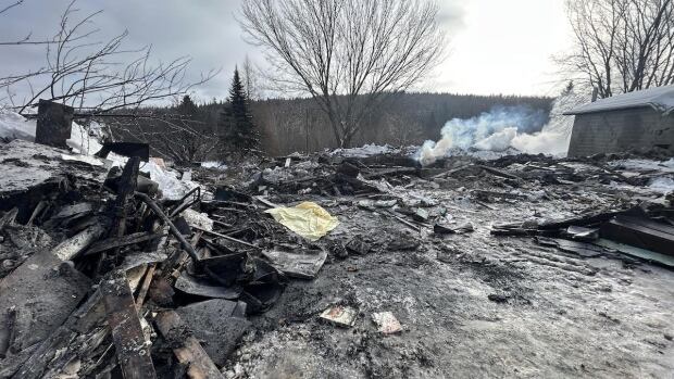 On Thursday morning, there was still smoke at the site of a house fire in Haut-Madawaska. A charred area with rubble lying around and a plume of smoke.