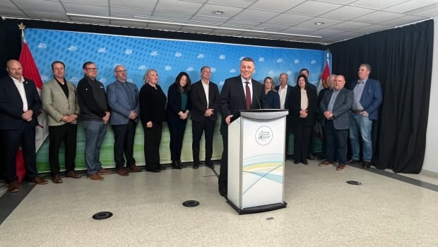 "Leadership is more than just one person,' says Premier Dennis King as he resigns Thursday, Feb 20. Man in suit stands aat podium