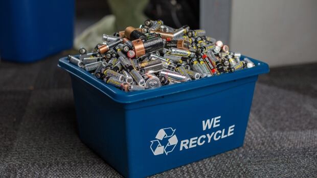 Batteries, Battery, recycling, recycled batteries, energizer batteries, duracell batteries, alkaline batteries, AA. AAA, blue box, WE recycle , used batteries, dead batteries, blue bins, recycle bins Toronto, Ontario, CRD Jun 24 2015, (David Donnelly/CBC) A bin full of batteries on the floor