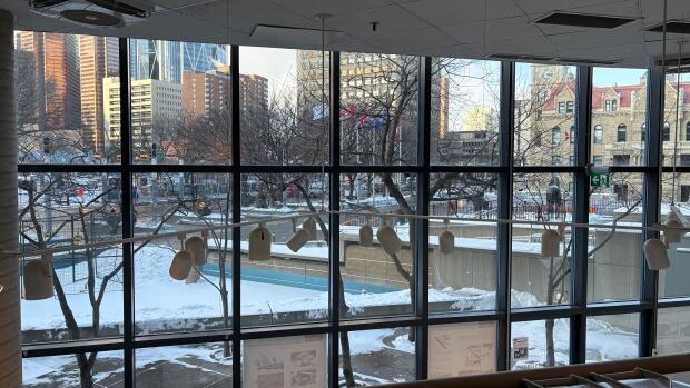 The Triangle Space has sat mostly empty for the past decade, the city is looking for someone to lease it. An interior shot of a building looking out onto a city.