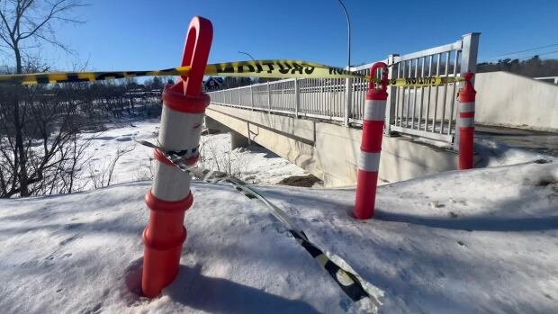 Construction on the Marysville Bridge in Fredericton was completed last fall. But even as the bridge is now open, documents give an explanation for lengthy delays locals faced for years. Cones in front of a bridge and a frozen river