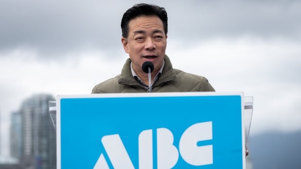 Vancouver Mayor Ken Sim speaks during an ABC party news conference in Vancouver, B.C., on February, 20 2025. An East Asian man speaks at a podium marked with a blue 'ABC Vancouver' sign.