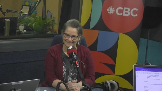 Gina Vliet did a talk titled "How to Dispose of a Body in Alberta: the intersection of organ, tissue and body donation," at the Nerd Nite Edmonton event on Thursday. A woman sitting inside the CBC Edmonton studio.