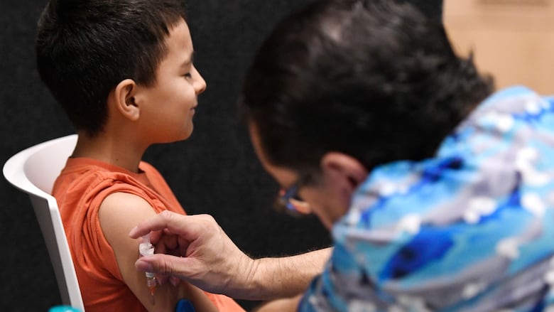 Mandatory Credit: Photo by ANNIE RICE/EPA-EFE/Shutterstock (15174635g) Nine-year-old Jexer Brayan receives a MMR vaccine, which protects against contracting the disease measles, at City of Lubbock Health Department in Lubbock, Texas, USA, 01 March 2025. This is Brayan's first dose. Measles Outbreak in West Texas, Lubbock, USA - 01 Mar 2025