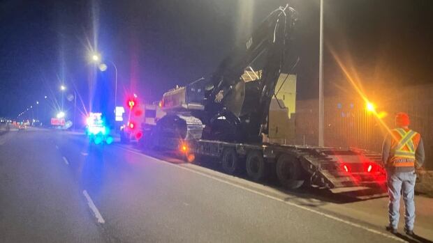RCMP released this image of the tractor-trailer and the large piece of heavy machinery that struck the 34th Street bridge over the Sherwood Park Freeway late Monday. A piece of heavy machinery on a large trailer.