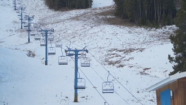 Castle Mountain Resort reported its snowpack is about 75 per cent of the average for the first week of March. Ski hill and chair lifts.