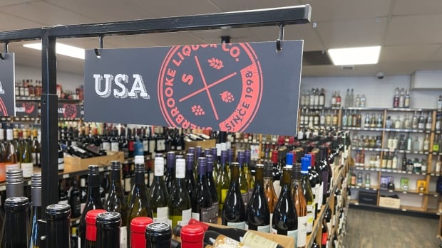 American wine at Sherbrooke Liquor in Edmonton. A shelf of wine bottles in a liquor store with a large sign above that reads "USA."