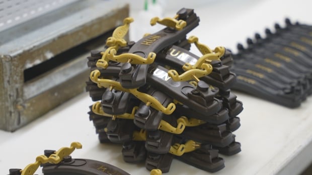 Kun Shoulder Rests are made in Canada and are soon-to-be tariffed in the United States. The constant policy changes feel like "recklessness" to the company and are making it hard to plan ahead. A pile of violin shoulder rests are shown at the Kun assembly facility in Ottawa.