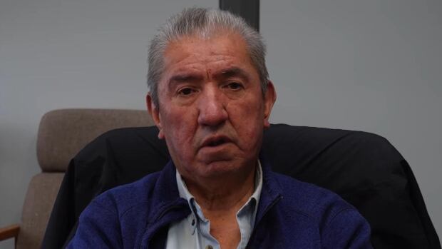 Homalco Chief Darren Blaney spoke in a video posted to social media this week to announce his nation's declaration of a state of emergency due to the toxic drug crisis. A man with silver hair sits in a chair.