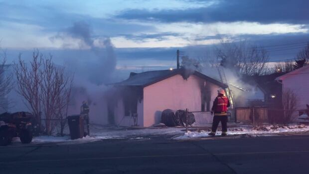 The Town of Torbay alerted residents over a major traffic disruption due to a house fire, around 8:00 P.M. friday evening. House smoking with firefighter standing outside
