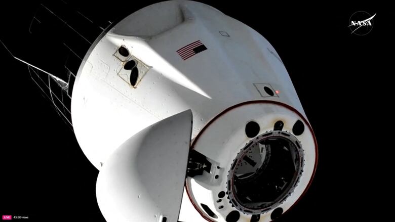 A achromatic  abstraction  capsule is shown against a achromatic  backdrop. There is simply a NASA logo successful  the corner. 