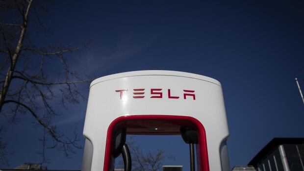A Tesla electric vehicle charging station is pictured in Surrey, British Columbia on Monday April 11, 2021. A charging station reading 'Tesla'.