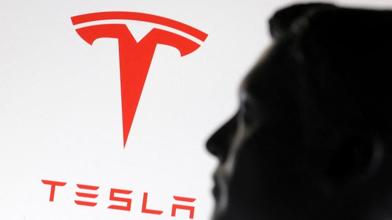 A 3D-printed miniature model of Elon Musk and the Tesla logo are seen in this illustration taken January 23, 2025. 