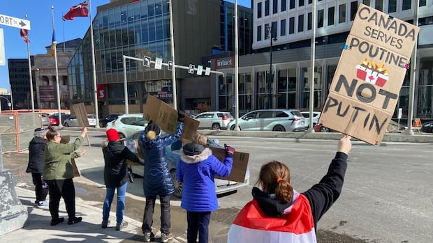 Winnipeggers rally outside U.S. Consulate to stand up for Canadian sovereignty
