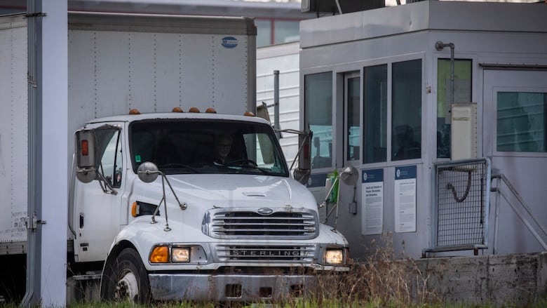 A truck is seen stopped at a border crossing checkpoint.