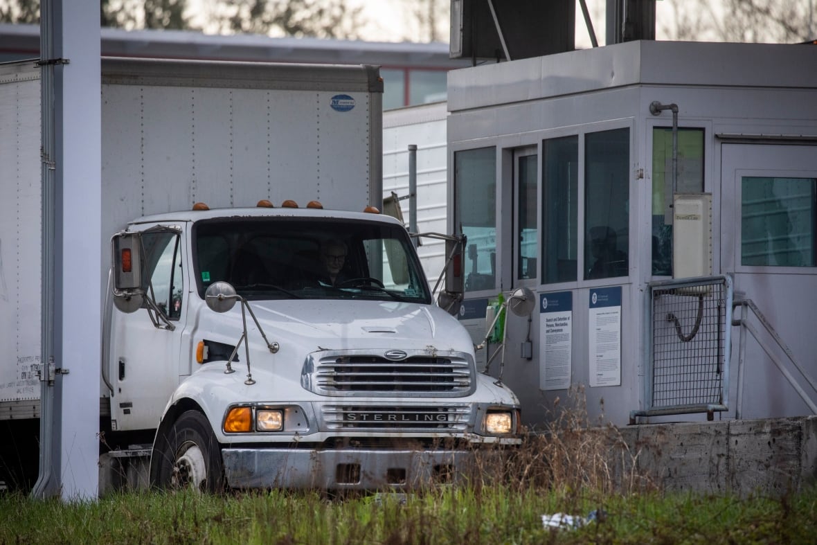 A truck is seen stopped at a border crossing checkpoint.