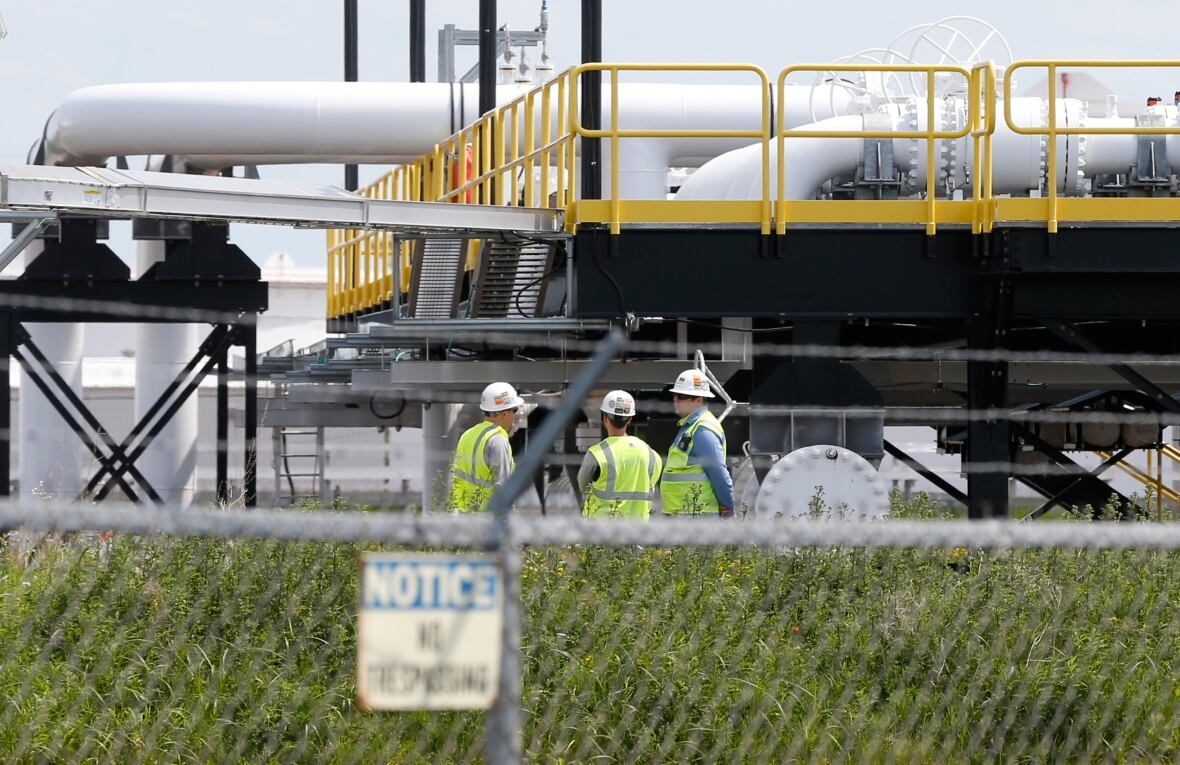 FILE - In this June 29, 2018, record  photo, workers look   implicit    the Superior terminal of Enbridge Energy successful  Superior, Wis. The authorities   of Minnesota has gone to national  tribunal  to artifact  a suit  implicit    Enbridge Energy's Line 3 lipid  pipeline task  from proceeding successful  tribal court. (AP Photo/Jim Mone, File)