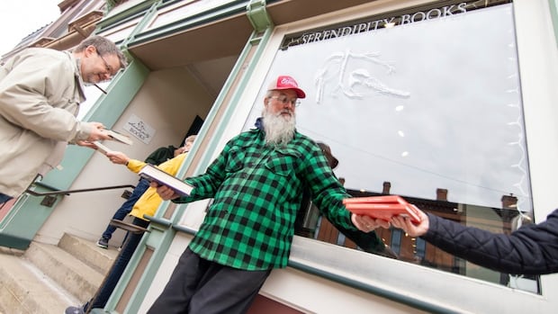 Why a Michigan community formed a human chain to move 9,100 books, one at a time