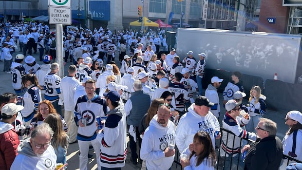 Spring whiteout hits downtown Winnipeg as thousands take to street for start of Jets' playoff run