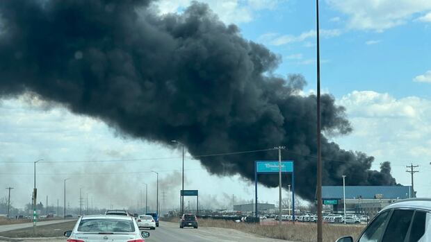 Fire along Fermor Avenue near Perimeter Highway worries area business owner, forces road closure