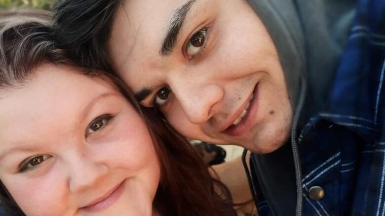 A smiling antheral   and woman.