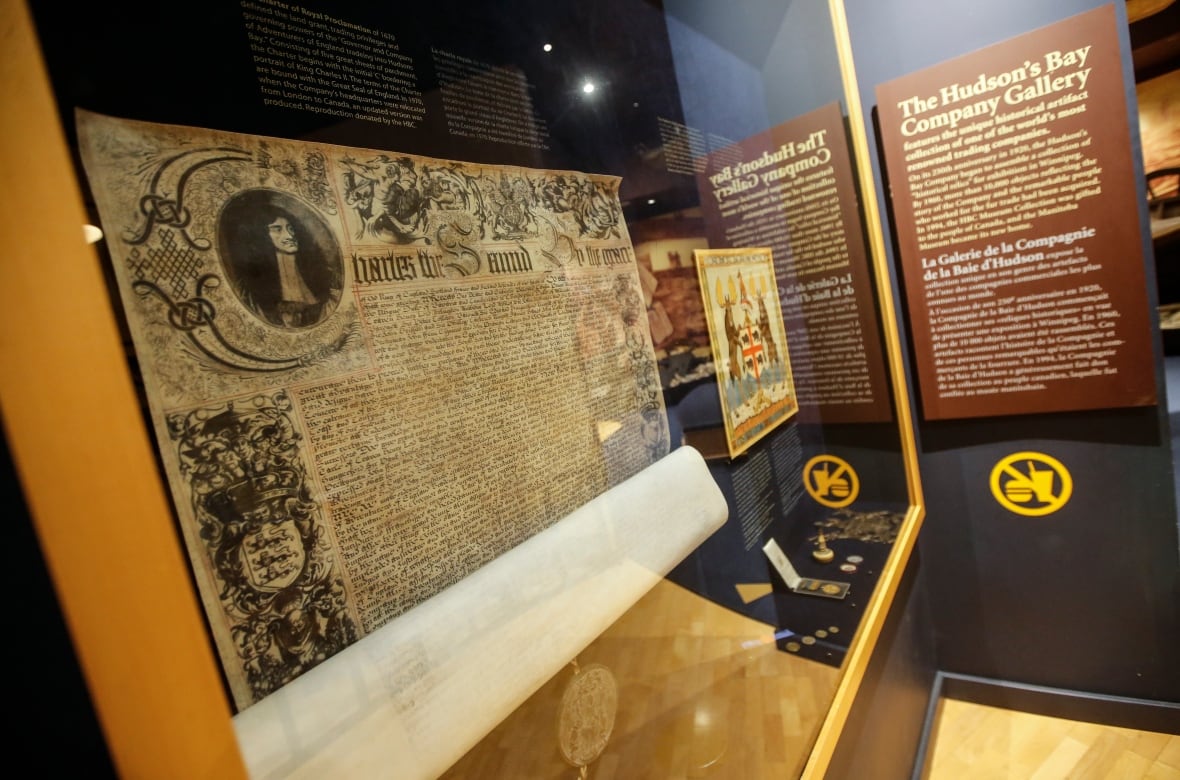 Artifacts are displayed in glass cases