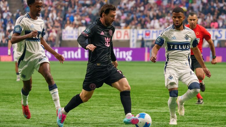 Lionel Messi dribbles the shot  against the Vancouver Whitecaps.