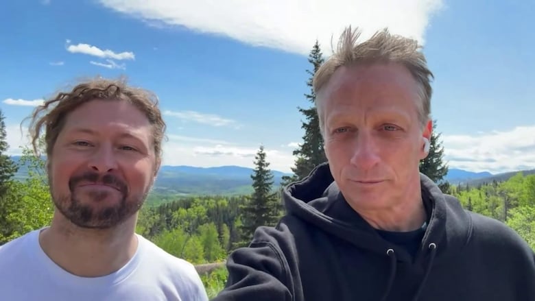 Two men successful  the mountains.