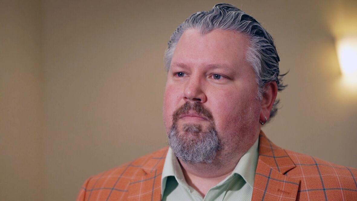 A man with grey hair.