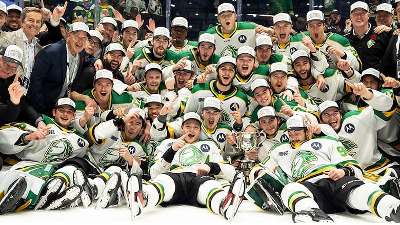 London Knights players and staff pose for a team photo after the Ontario Hockey League team defeated the Medicine Hat Tigers of the Western Hockey League 4-1 in the Memorial Cup finl in Rimouski, Que., on June 1, 2025.