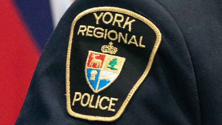 Police badge on arm