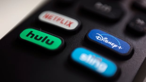 A remote control showing buttons with the brands for Netflix, Disney+, Hulu and Sting is shown.
