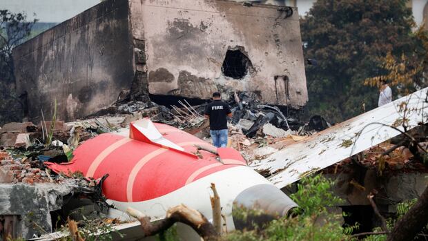 Air India crash investigators recover plane's black box from a rooftop