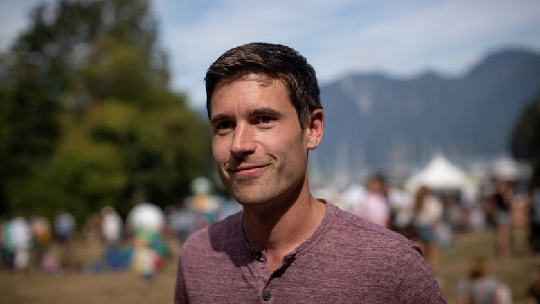 A man in a red T-shirt.