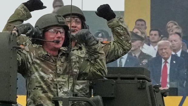 Military parade barrels through Washington with tanks, troops and 21-gun salute