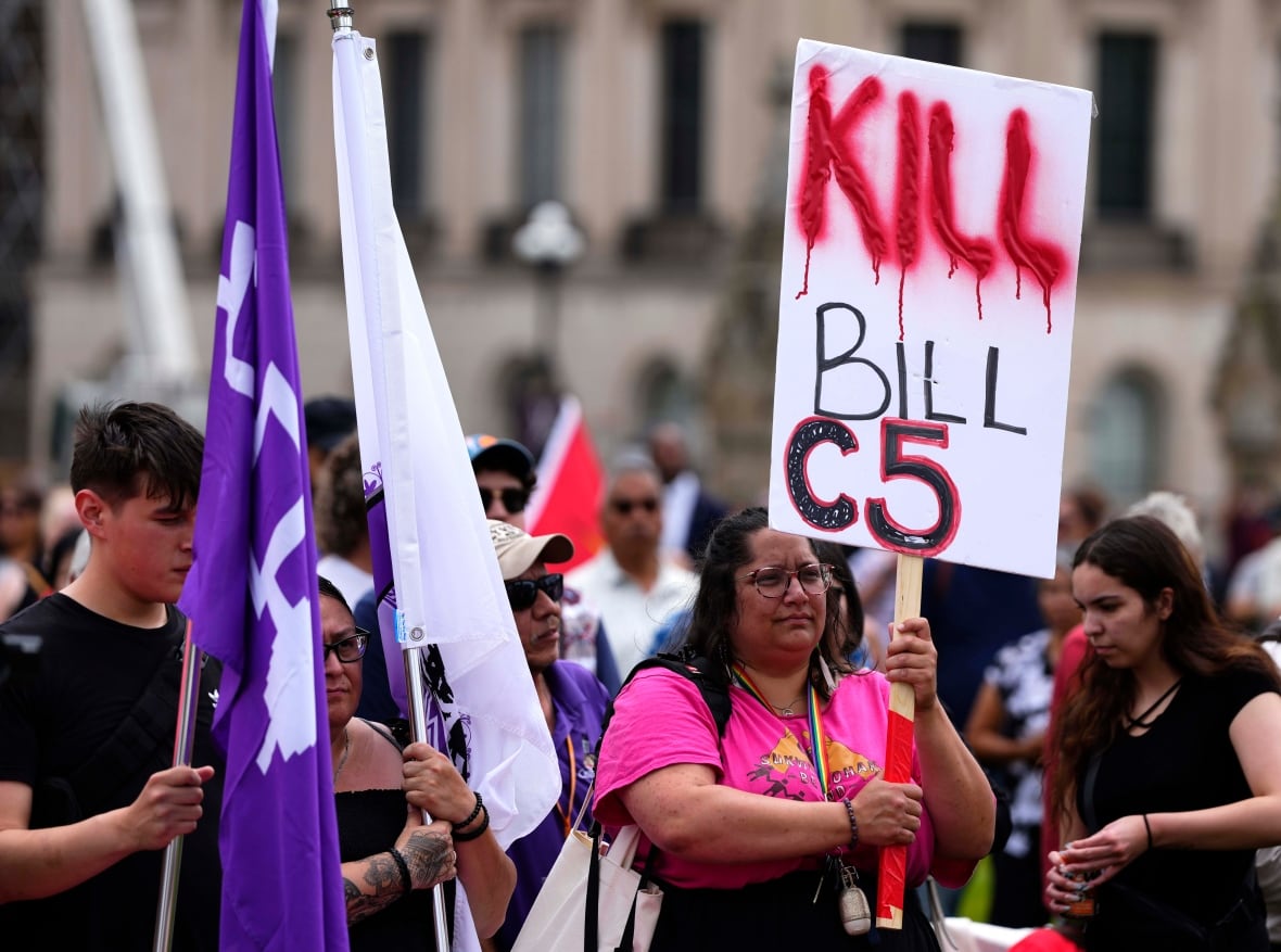 People rally against Bill C-5 on Parliament Hill in Ottawa, on Tuesday, June 17, 2025.