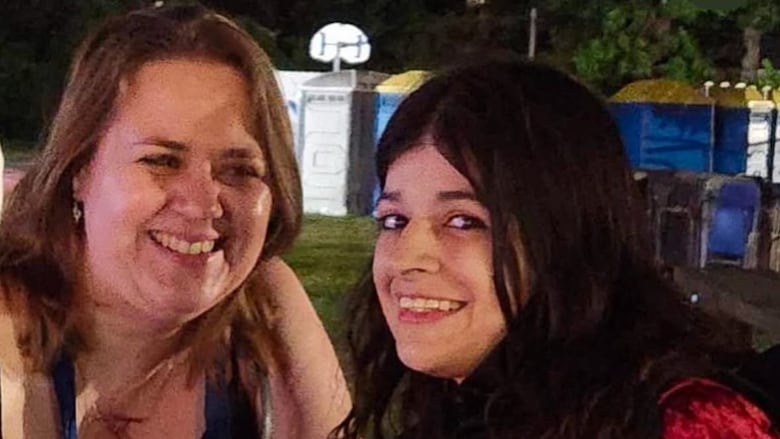 two women smile 