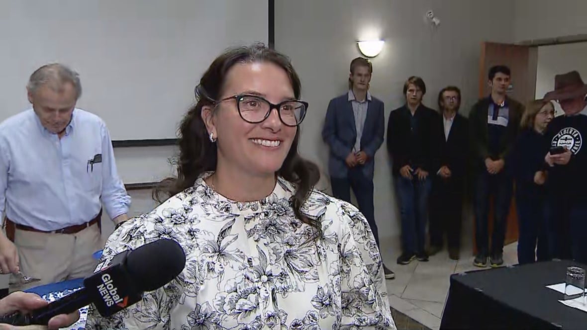 New MLA-elect Tara Sawyer smiles at her victory party in Olds, Alta.