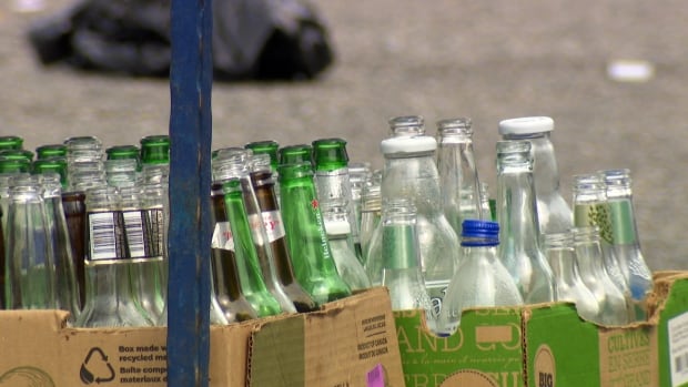 Trays of empty glass bottles.