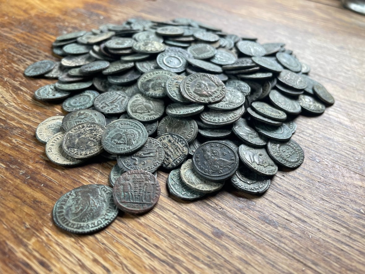 A close up of a pile of coins.